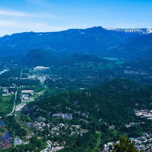 Downtown Squamish and the valley floor seen from the Stawamus Chief, with forested mountains behind